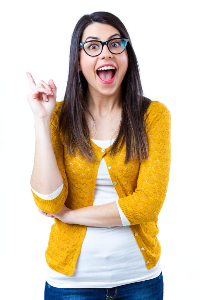 Portrait of pretty young woman with casual wear pointing up
